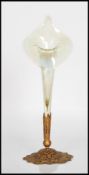 A 19th Century Victorian vaseline glass spill vase of tapering form having a flared rim set within a