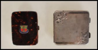 A silver continental compact of square form having engine turned decoration to front and verso,