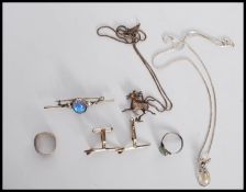 A silver Chinese necklace pendant of the horse Gansu riding on the swallows back. Set to a later box