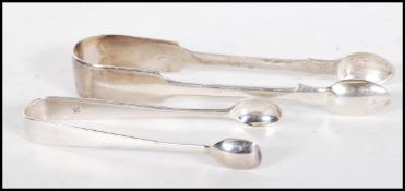 Two sets of silver hallmarked sugar tongs to include a Robert Wallis set hallmarked for 1843 and a