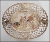 A 19th Century continental silver dish having raised pierced openwork sides with floral swags and