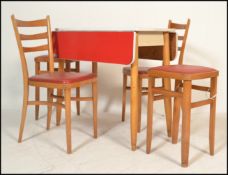 A retro mid century red formica and beech wood drop leaf kitchen dining table having a matching pair