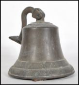 A 20th Century cast metal bell having floral relief decoration to the borders, having a right angled