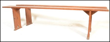 A pair of 19th century French refectory pig benche