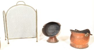 A selection of 19th Century fireside items to include a brass fire grate, a copper coal scuttle