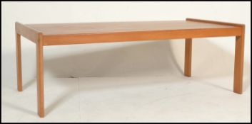 A retro mid 20th Century ash coffee table of simple rectangular form raised on four straight legs.