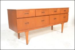 A mid 20th Century retro teak wood sideboard / credenza having a set of short drawers  atop deep