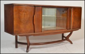 A retro 20th Century teak wood sideboard / credenza - cocktail cabinet dresser having revolving