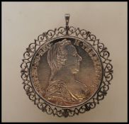 A silver Maria Theresa Silver Thaler coin, bearing