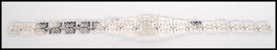 A 20th century silver plate EPNS nurses belt. Each panel of pierced form graduating in size to the