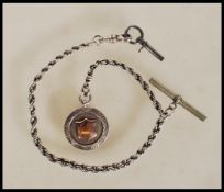 A 20th Century silver Albert pocket watch chain of rope twist design having T-bar and clasp end.