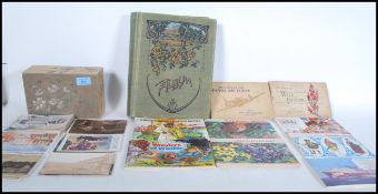 A selection of vintage ephemera to include a selection of postcards and greetings cards to include