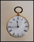 An 18ct gold cased open face pocket fob watch having a white enamelled face with roman numerals to