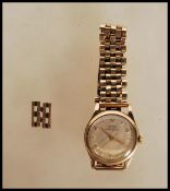 A hallmarked 9ct gold vintage Swiss sixteen jewel Tissot Antimagnetique gents wrist watch, having