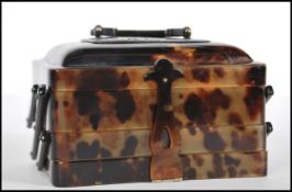 A mid 20th Century 1940's / 50's faux tortoiseshell three section jewelry box, having horn