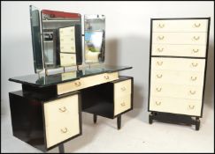 A vintage mid 20th Century Ernst Gomme for G Plan two tone bedroom suite, consisting of a tallboy