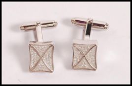 A pair of stamped 925 silver cufflinks having square heads set with CZ's. Weight 8.5g.