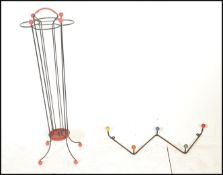 A stunning mid 20th Century four sectional atomic metal frame umbrella stand with carry handle to