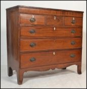 A Georgian early 19th century mahogany chest of drawers having 3 short drawers over graduating