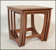 A 1970's G-Plan ' Astro ' teak wood nest of tables. The tables of graduating form with each being