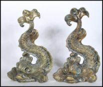 A pair of late 19th early 20th Century cast brass door stops modelled as Maltese Dolphins.