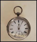 A silver hallmarked open face pocket watch dating from the late 19th century,  having white enamel