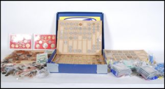 A collection of world coinage mostly British to include commemorative coins, bank notes,  silver