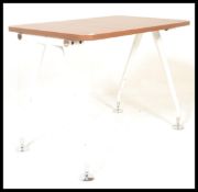 A 20th century desk, walnut top raised on angular