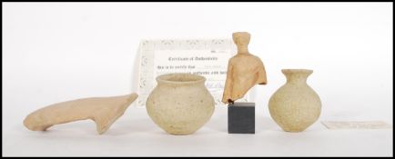 An ancient Greek terracotta figure fragment depicting a robed man believed to be from around 200