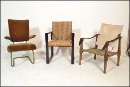 A vintage mid century Safari Chair designed and in the manner of Kaare Klint. The wooden framed