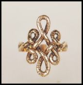 A 20th Century hallmarked 9ct gold ring having a knot design head. Hallmarked London 1972. Weight