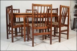 A mid century Danish inspired teak wood dining room suite to include an extending dining table