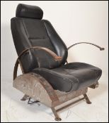 A retro 20th century car chair converted into a retro armchair in the manner of Ron Arad having