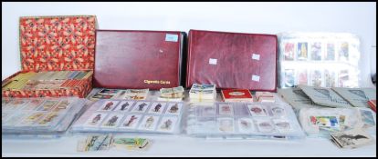 A large collection of assorted vintage cigarette / picture cards dating from the early 20th