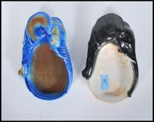 A pair of early 20th century lustre porcelain ashtrays in the form of Elephants. Unmarked to the