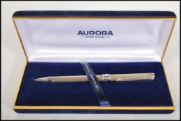 A stamped 925 silver ball point pen by Aurora, set inside a blue velvet lined box. Weight 20.6g.