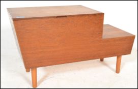 A retro 20th Century teak wood stepped work box / sewing box, harry handle to top hinged top with