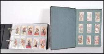 A collection of vintage cigarette cards across two albums to include full and parts sets; Ringer's