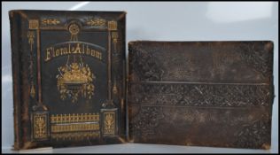 A 19th Century Victorian leather photograph album having metal lock with gilt page ends containing a
