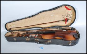 An early 20th century Viola musical instrument having two piece maple back. Ebonised neck and tuning