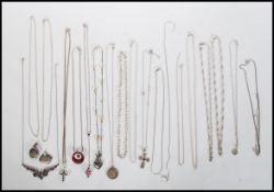A selection of stamped 925 necklace chains and pendants to include a crucifix pendant set with a