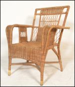 An early to mid century bamboo / whicker rattan weave plantation chair. Swept arms with a pierced