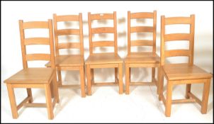 A set of good quality antique style solid oak country kitchen dining chairs. Raised on block legs