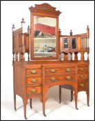 A late 19th century Victorian large walnut dressing chest with tall gallery back having a central