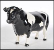 A 20th Century Beswick ceramic figurine of  CH Coddington Hilt bar bullock. Length 20 cm Stamped