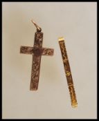 An early 20th Century Edwardian hallmarked 9ct gold crucifix pendant engraved with floral