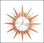 An original retro vintage 1970's Metamec sunburst wall clock having Arabic and batten numerals to