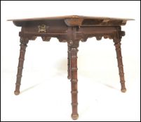 A late Victorian Arts and Crafts ecclesiastical solid oak table being in the manner of Morris &