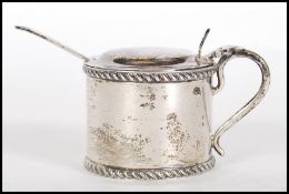 A late Victorian silver hallmarked table condiment pot with blue glass liner. Hallmarked for