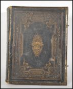 A late 19th / early 20th Century self interpreting family bible. Leather bound with brass brackets